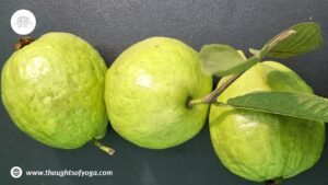 Fresh guava fruit with green leaves.