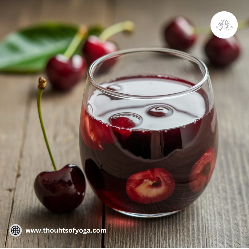 Bowl of ripe, juicy cherries on a wooden table