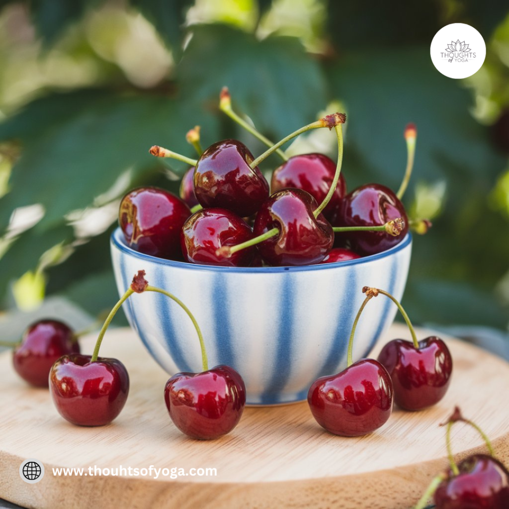 Bowl of ripe, juicy cherries on a wooden table