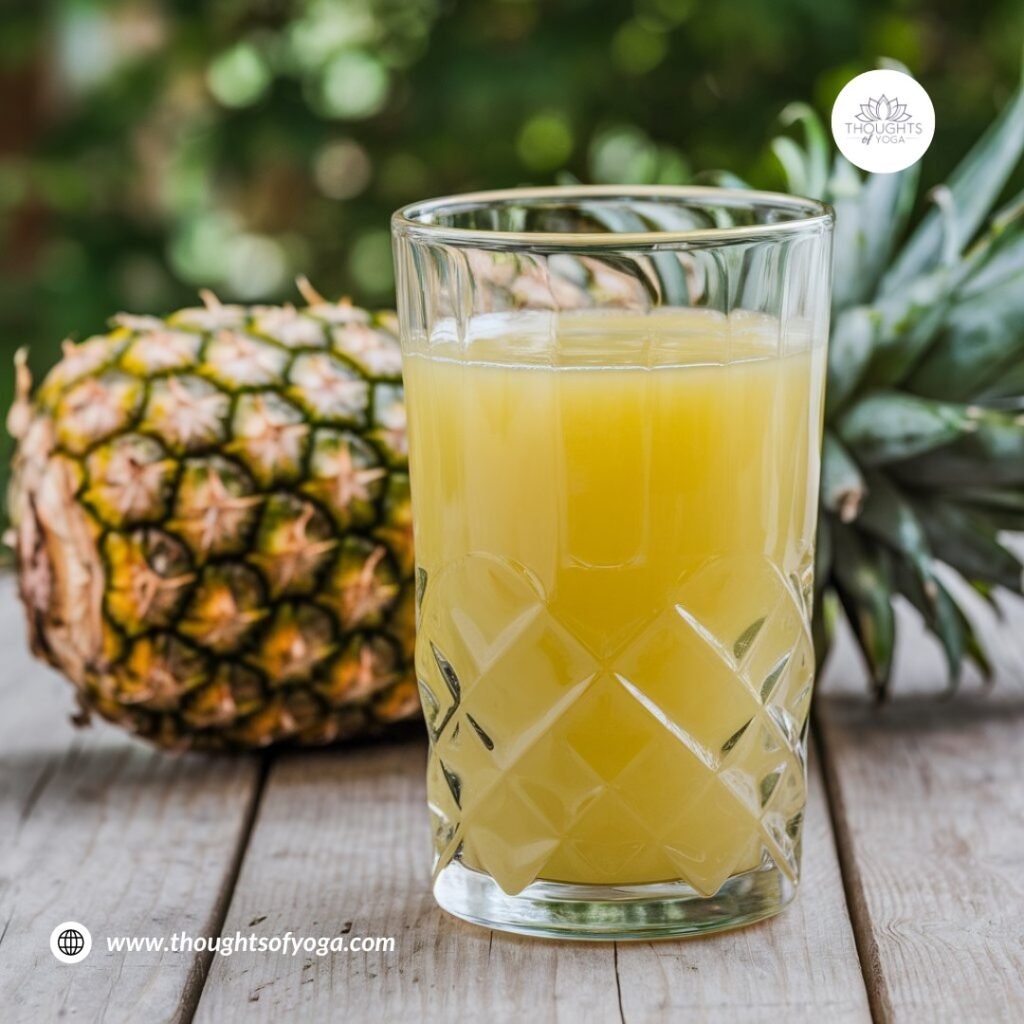 Refreshing glass of pineapple juice with fruit slices as garnish