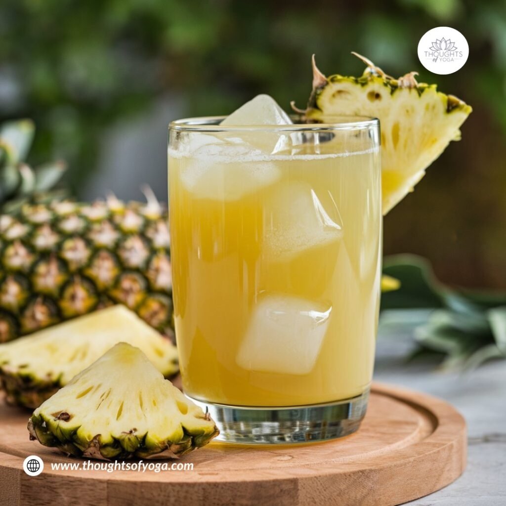 Refreshing glass of pineapple juice with fruit slices as garnis