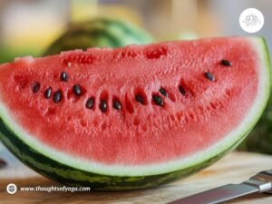 Refreshing watermelon smoothie in a glass, garnished with mint leaves